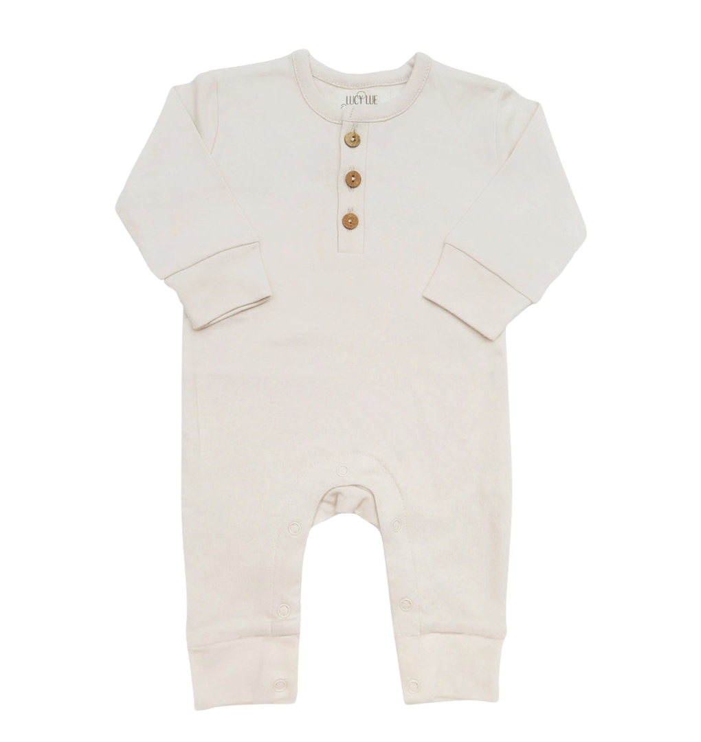 Beige baby romper with button details on a white background one piece coverall Lucy lue organics