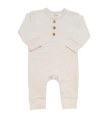 Beige baby romper with button details on a white background one piece coverall Lucy lue organics