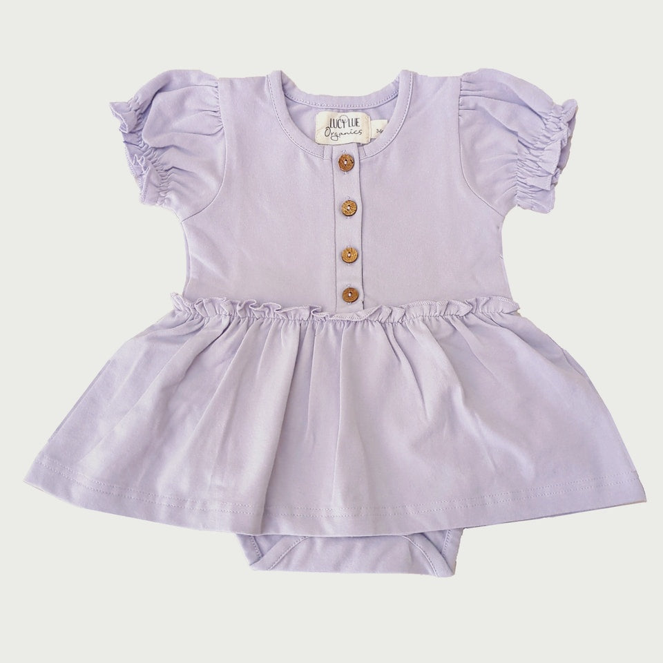 Organic skirted bodysuit. Baby girl dress. Organic baby clothes. Modern baby lcothes. Lucy Lue Organics. button dress for baby girl. Vintage baby girl clothes