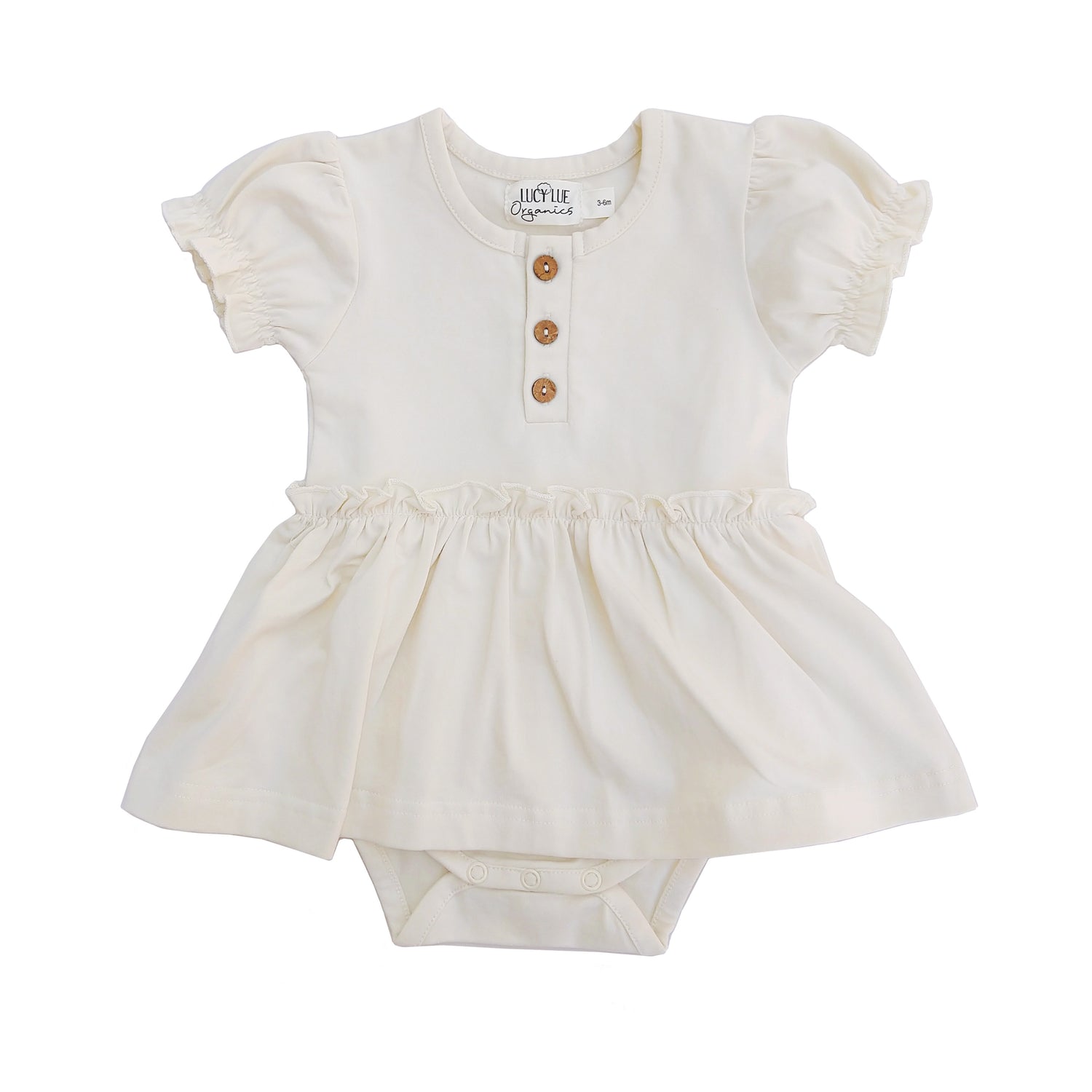 Organic skirted bodysuit. Baby girl dress. Organic baby clothes. Modern baby lcothes. Lucy Lue Organics. button dress for baby girl. Vintage baby girl clothes